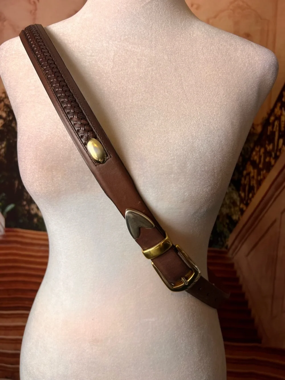 Izod Unique vintage genuine leather belt features a classic brown leather strap